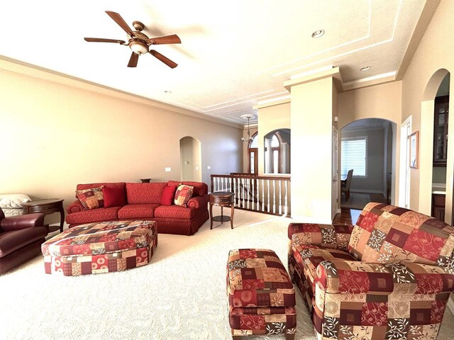25621 Honeycut Ave, Tomah, WI 54660 - living room with ornamental molding, arched walkways, ceiling fan, and carpet flooring