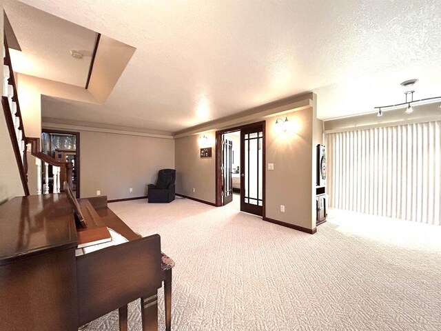 25621 Honeycut Ave, Tomah, WI 54660 - interior space featuring baseboards, a textured ceiling, stairway, and light colored carpet