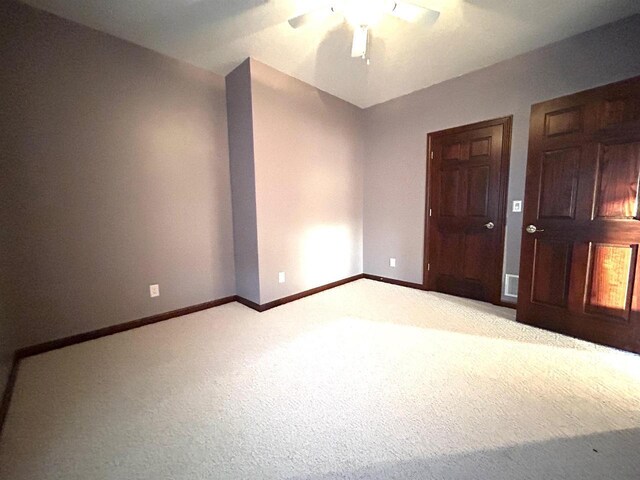 25621 Honeycut Ave, Tomah, WI 54660 - unfurnished bedroom featuring baseboards, a ceiling fan, and light colored carpet