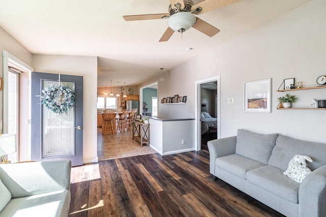N1179 County Road O, Stoddard, WI 54658 - living area featuring baseboards, ceiling fan with notable chandelier, and dark wood finished floors