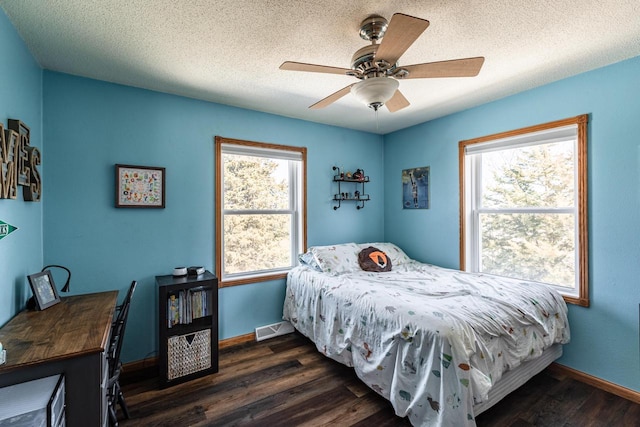 N1179 County Road O, Stoddard, WI 54658 - bedroom with visible vents, wood finished floors, and multiple windows