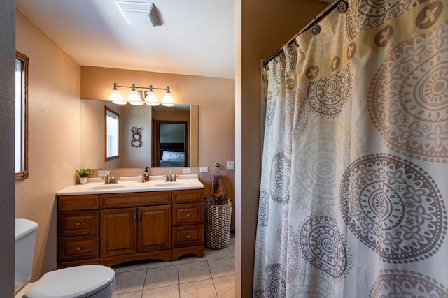 N1179 County Road O, Stoddard, WI 54658 - full bath with toilet, tile patterned floors, a sink, visible vents, and double vanity