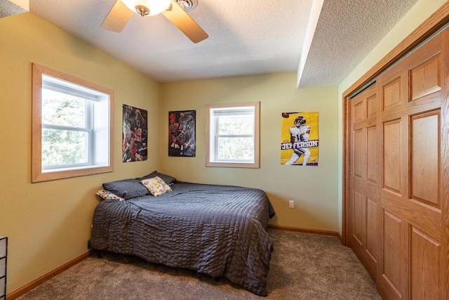 N1179 County Road O, Stoddard, WI 54658 - carpeted bedroom with baseboards, a textured ceiling, and multiple windows