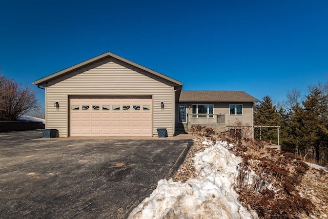 N1179 County Road O, Stoddard, WI 54658 - view of side of property with aphalt driveway and an attached garage