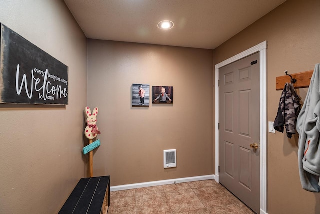 N1179 County Road O, Stoddard, WI 54658 - hall with baseboards, visible vents, and tile patterned floors