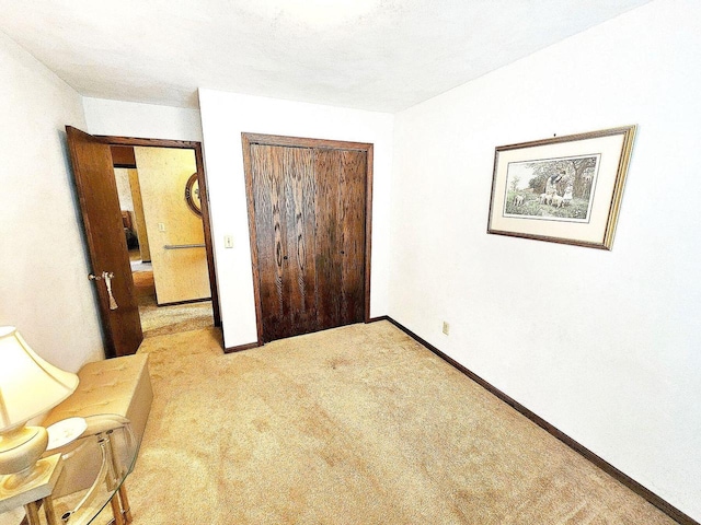 1090 Shabbona Dr, Fontana, WI 53125 - unfurnished bedroom with a closet, baseboards, and light colored carpet