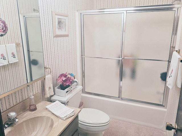 1090 Shabbona Dr, Fontana, WI 53125 - full bath featuring wallpapered walls, shower / bath combination with glass door, vanity, and toilet