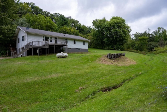 view of yard featuring stairs and a wooden deck