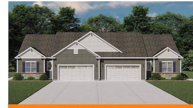 craftsman-style home with a front yard, a garage, stone siding, and concrete driveway