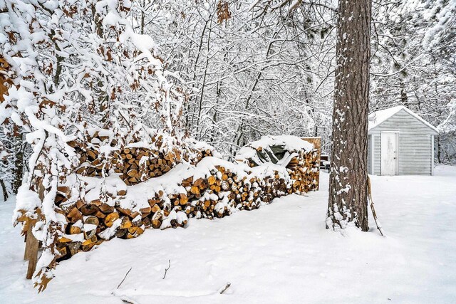 W11490 Boat Landing 7 Rd, Athelstane, WI 54104 - yard covered in snow with an outdoor structure