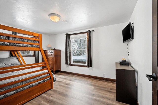 W11490 Boat Landing 7 Rd, Athelstane, WI 54104 - bedroom with baseboards and wood finished floors