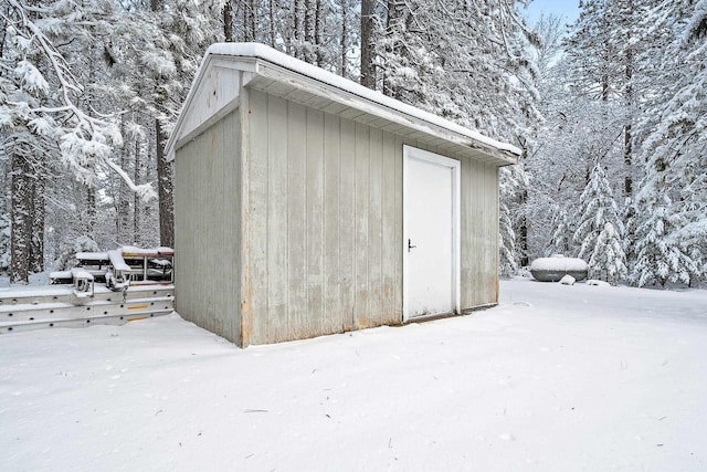 W11490 Boat Landing 7 Rd, Athelstane, WI 54104 - snow covered structure featuring a storage unit and an outdoor structure