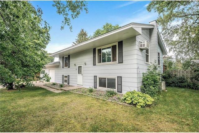 806 Oak Ridge Dr, Osceola, WI 54020 - rear view of property featuring a yard and an attached garage