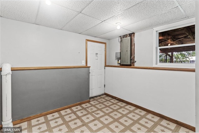 806 Oak Ridge Dr, Osceola, WI 54020 - spare room with baseboards, a drop ceiling, and light floors