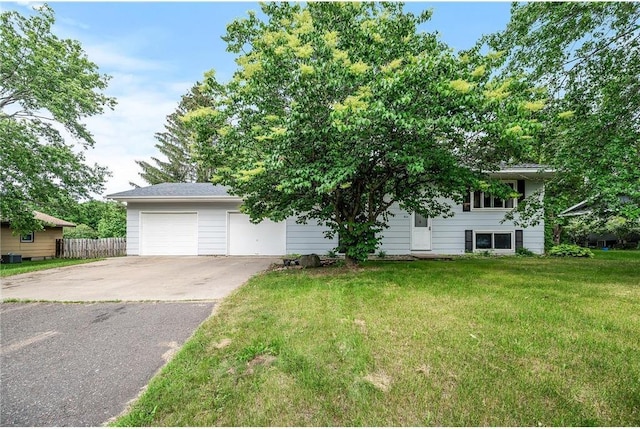 806 Oak Ridge Dr, Osceola, WI 54020 - view of front facade with driveway, a garage, and central AC unit