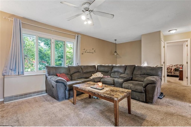 806 Oak Ridge Dr, Osceola, WI 54020 - carpeted living area with ceiling fan and baseboards