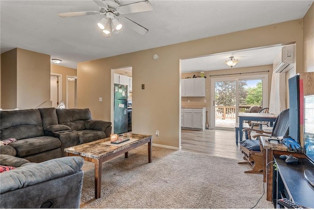 806 Oak Ridge Dr, Osceola, WI 54020 - living area with an AC wall unit, a ceiling fan, light colored carpet, and baseboards