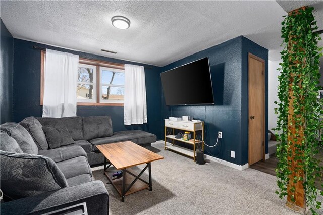 3374 Gerrard Ave, Eau Claire, WI 54701 - living room with visible vents, carpet, baseboards, and a textured ceiling