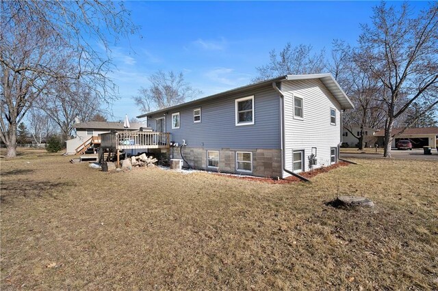 3374 Gerrard Ave, Eau Claire, WI 54701 - back of house with a yard and a wooden deck