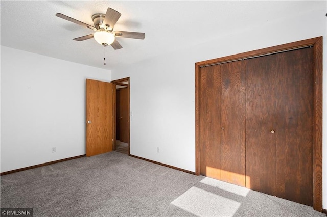 3374 Gerrard Ave, Eau Claire, WI 54701 - unfurnished bedroom with a closet, a ceiling fan, baseboards, and carpet