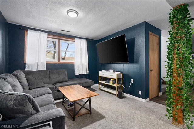 3374 Gerrard Ave, Eau Claire, WI 54701 - carpeted living area featuring baseboards, a textured ceiling, and visible vents