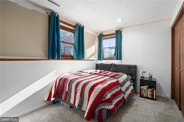 3374 Gerrard Ave, Eau Claire, WI 54701 - carpeted bedroom featuring baseboards, a textured ceiling, and visible vents