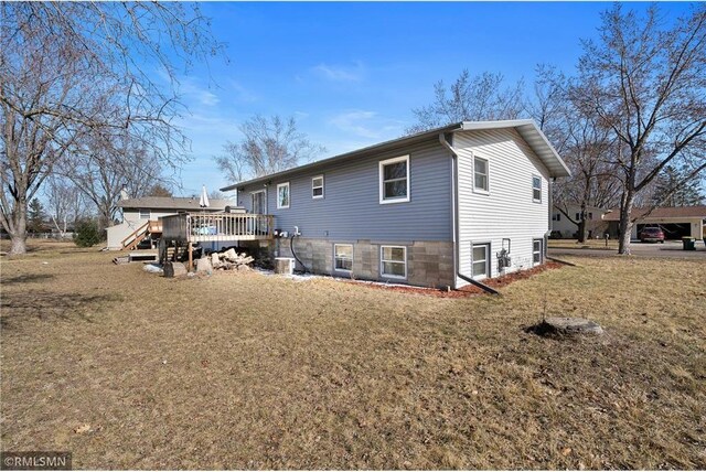 3374 Gerrard Ave, Eau Claire, WI 54701 - rear view of house with a deck and a yard