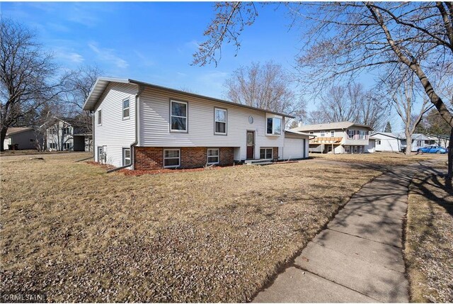 3374 Gerrard Ave, Eau Claire, WI 54701 - exterior space with an attached garage and a front yard