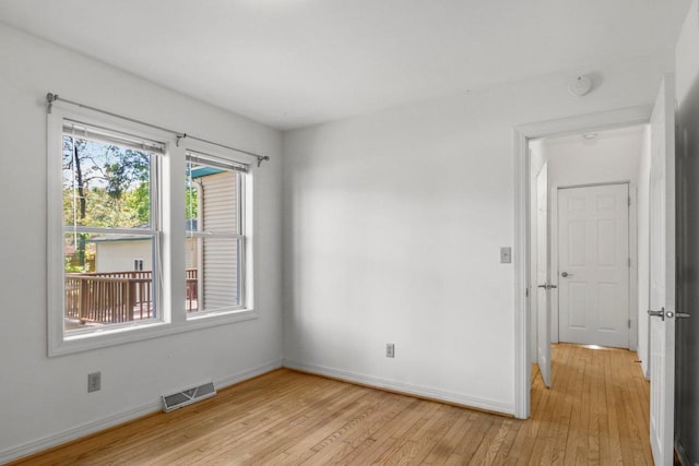 725 Eugenia Ave, Madison, WI 53705 - unfurnished room featuring light wood finished floors, baseboards, and a smoke detector