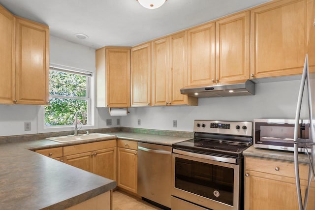 725 Eugenia Ave, Madison, WI 53705 - kitchen with stainless steel appliances, a sink, and light brown cabinets