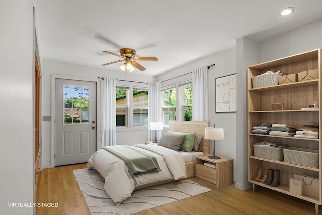 725 Eugenia Ave, Madison, WI 53705 - bedroom featuring light wood-type flooring, ceiling fan, recessed lighting, and baseboards
