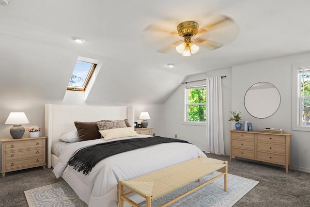 725 Eugenia Ave, Madison, WI 53705 - carpeted bedroom featuring ceiling fan, vaulted ceiling, and a skylight