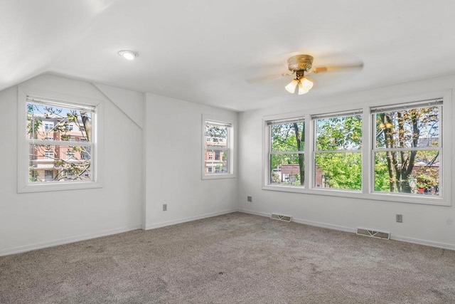 725 Eugenia Ave, Madison, WI 53705 - carpeted empty room featuring a ceiling fan, baseboards, and vaulted ceiling