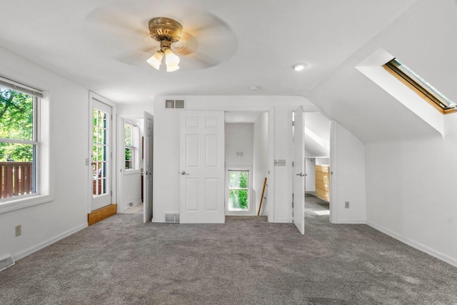 725 Eugenia Ave, Madison, WI 53705 - unfurnished bedroom with carpet floors, vaulted ceiling, ceiling fan, and baseboards