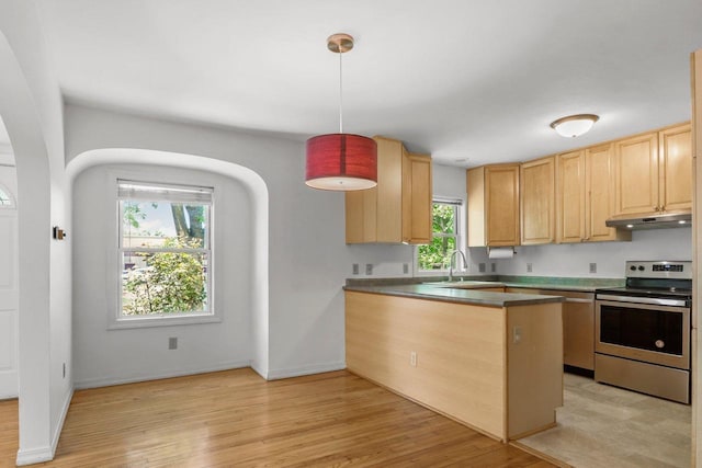 725 Eugenia Ave, Madison, WI 53705 - kitchen featuring appliances with stainless steel finishes, under cabinet range hood, light brown cabinets, and light wood-style floors