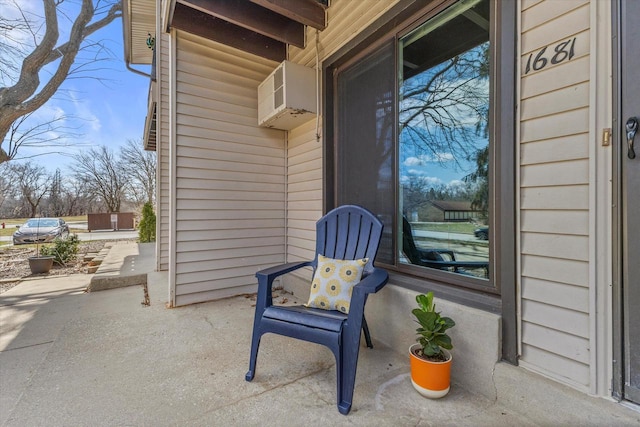 view of patio / terrace with a wall unit AC