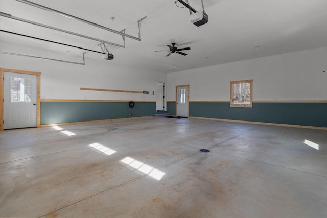 W4668 Reetz Rd, Princeton, WI 54968 - garage featuring a garage door opener and baseboards