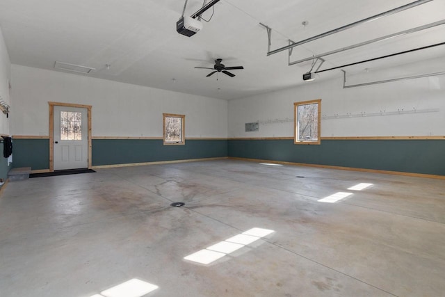 W4668 Reetz Rd, Princeton, WI 54968 - garage with a garage door opener and baseboards