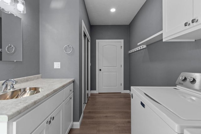 W4668 Reetz Rd, Princeton, WI 54968 - laundry area with a sink, dark wood-type flooring, separate washer and dryer, recessed lighting, and baseboards