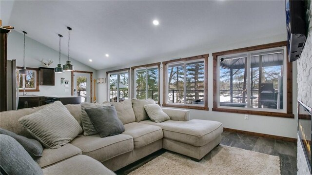 N2590 Warren Rd, Sarona, WI 54870 - living area featuring baseboards, lofted ceiling, and recessed lighting