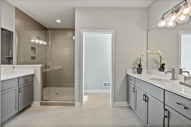 W214N4987 Casey Ct, Menomonee Falls, WI 53051 - full bath with vanity, a shower stall, tile patterned flooring, and recessed lighting