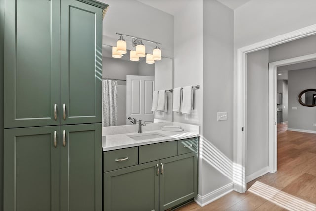 W214N4987 Casey Ct, Menomonee Falls, WI 53051 - bathroom featuring vanity, wood finished floors, and a chandelier