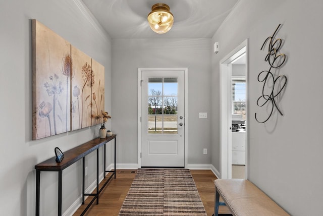 entryway featuring baseboards and dark wood finished floors