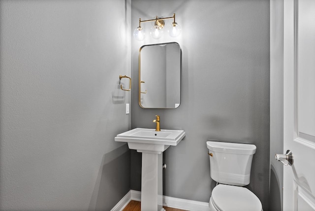 W214N4987 Casey Ct, Menomonee Falls, WI 53051 - half bathroom with toilet and baseboards