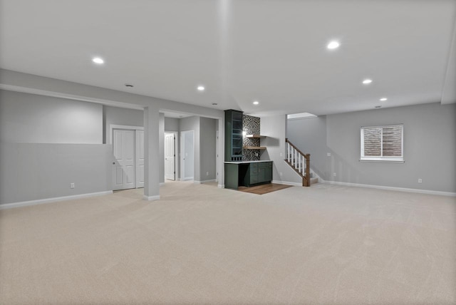 W214N4987 Casey Ct, Menomonee Falls, WI 53051 - finished below grade area featuring light carpet, stairs, and recessed lighting