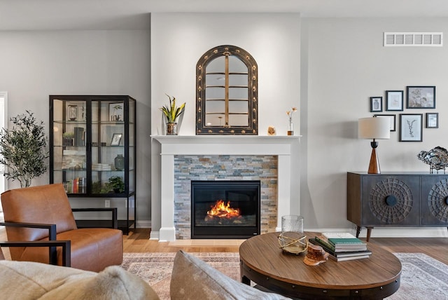 W214N4987 Casey Ct, Menomonee Falls, WI 53051 - living room featuring wood finished floors and a fireplace