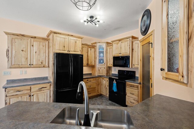 8464 County Rd S, Pulaski, WI 54162 - kitchen featuring a sink, black appliances, dark countertops, and light brown cabinetry