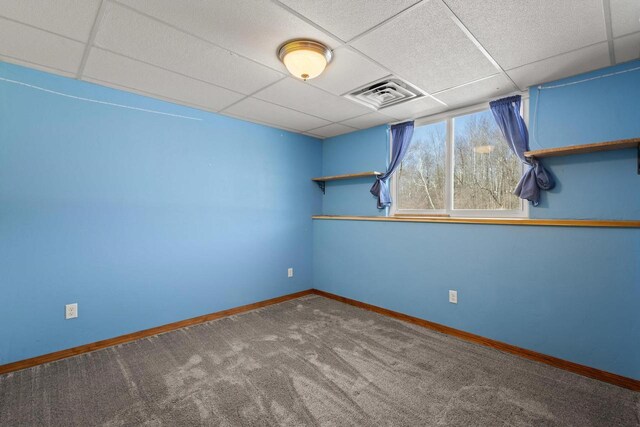 8464 County Rd S, Pulaski, WI 54162 - carpeted spare room with baseboards, visible vents, and a paneled ceiling