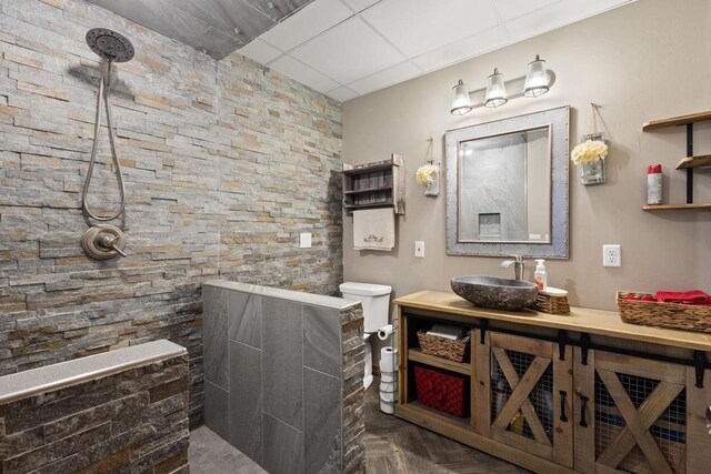 8464 County Rd S, Pulaski, WI 54162 - bathroom featuring a paneled ceiling, vanity, and walk in shower