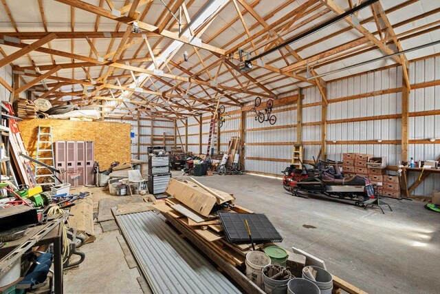 8464 County Rd S, Pulaski, WI 54162 - garage featuring metal wall and a workshop area